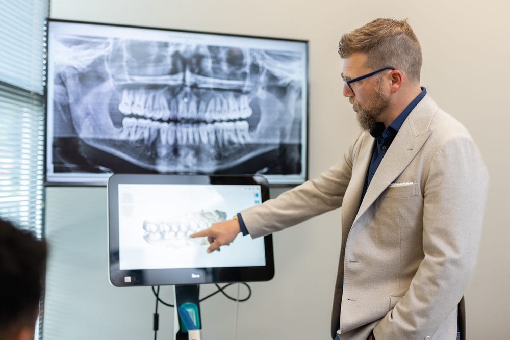 The Financing Advantage Most GP Orthodontic Programs Are Missing 2 Dr. Jason Gladwell explaining a treatment scan on screen