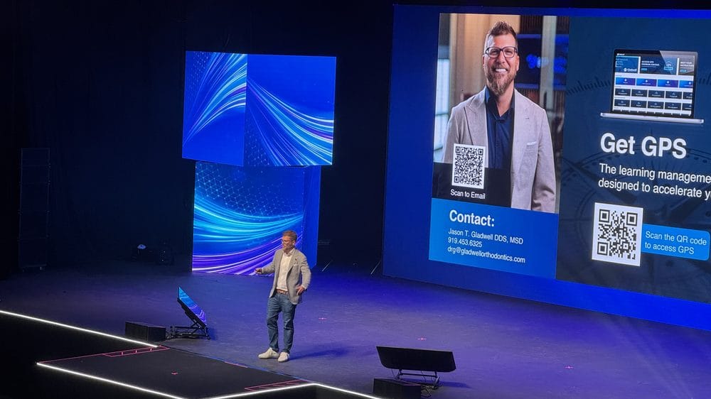Dr. Jason Gladwell closing his Align Evolution Summit session in front of a Get GPS slide