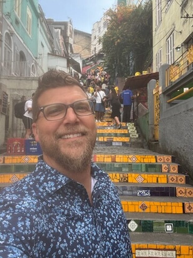 Dr. Jason Gladwell on the tiled Escadaria Selaron steps in Rio de Janeiro